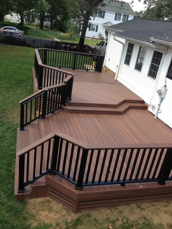 Multi-level composite deck with black aluminum railing