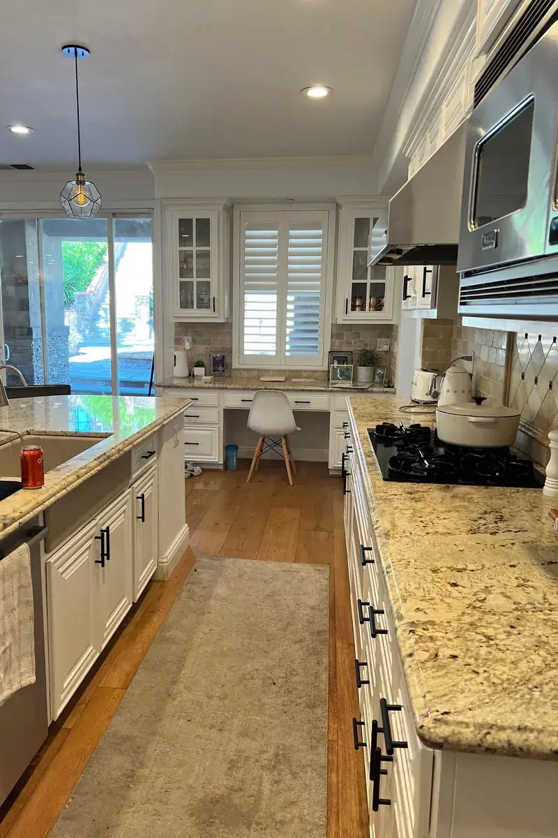 Kitchen remodel — granite counters, white cabinetry — R&L project