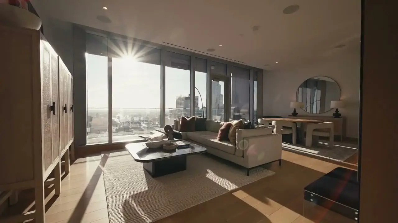 Open-concept living space with kitchen island and light wood floors